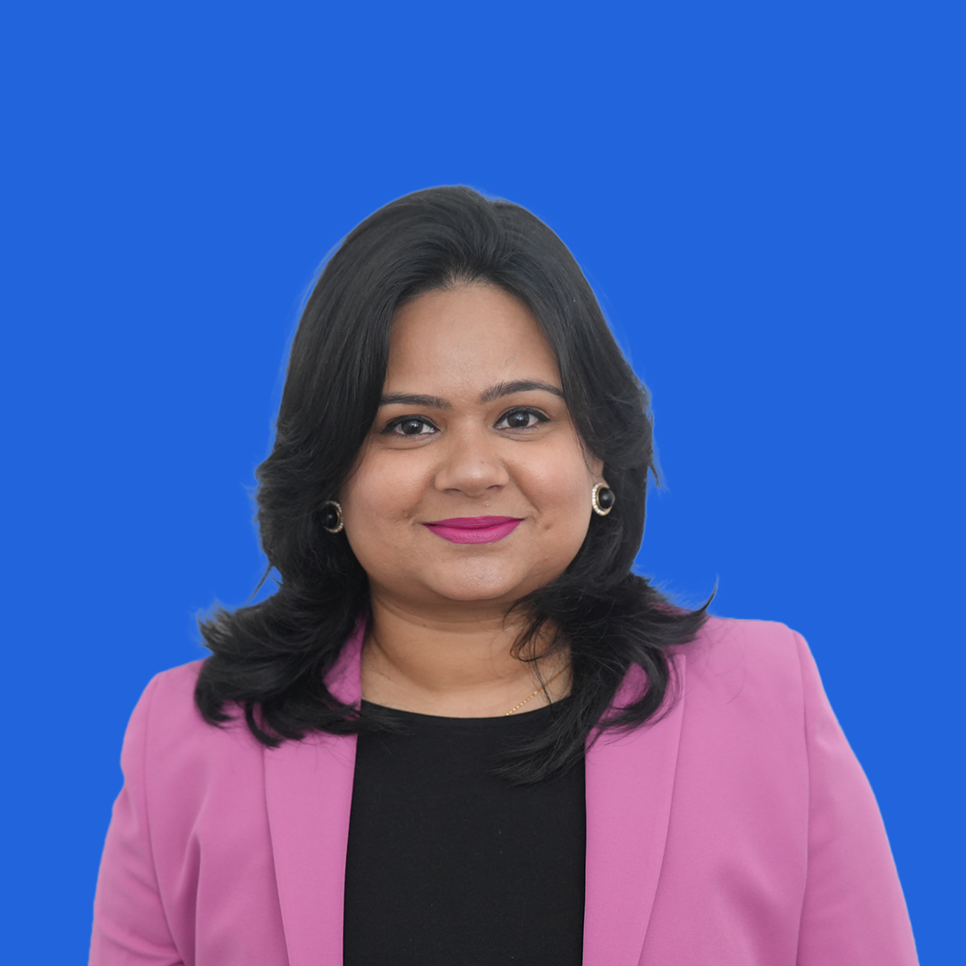 Headshot of female Swati Shukla placed on a blue background
