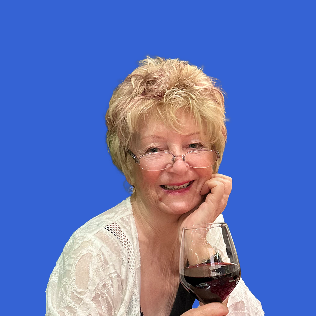 Headshot of female Kate Binnie placed on a blue background